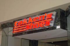 Takken's Shoes Illuminated Sign using Channel Letter & Neon