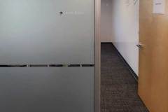 Resonant office conference room frosted glass with name sign close up in Goleta by Dave's Signs.