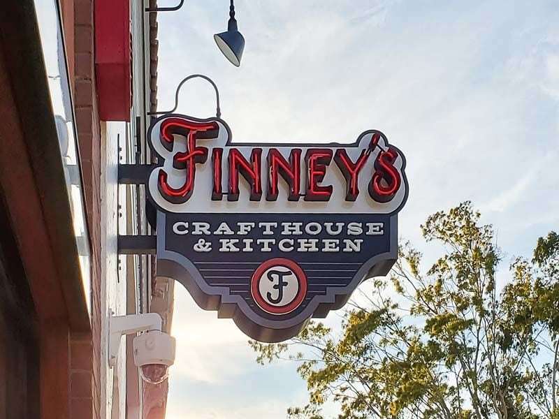 Finneys - Projecting blade sign -open face neon lit channel letter