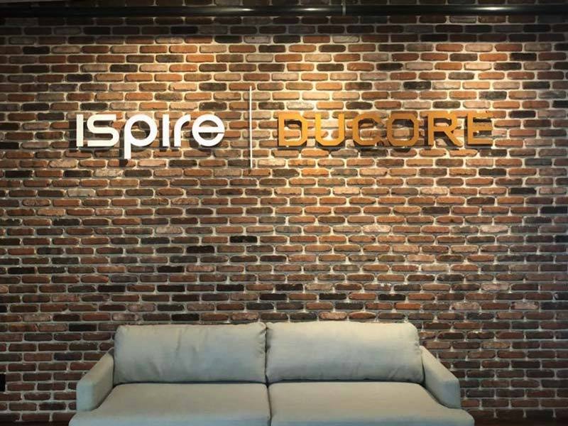 Indoor signs like this office lobby sign for Ispire | Ducore offer subtle branding and style.