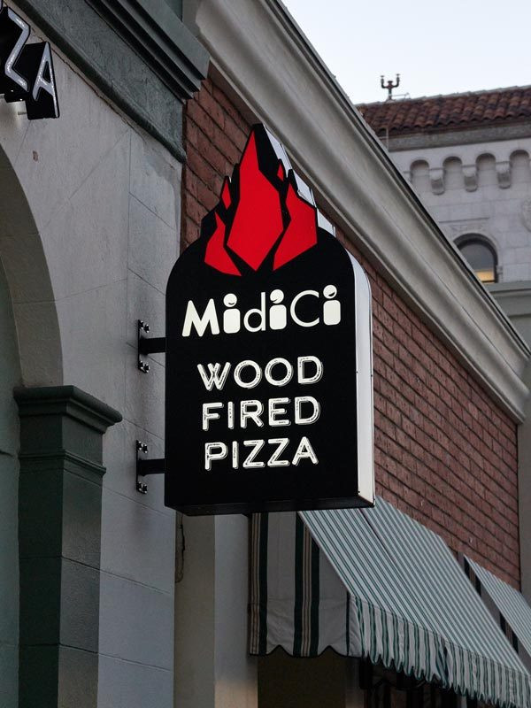 Aluminum signs with your logo like this custom shaped lightbox blade sign for Midici Wood Fired Pizza look great 24/7.