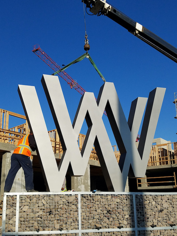 Installing the WW logo sign we created for Wagon Wheel in Oxnard. A new mixed use residential community.