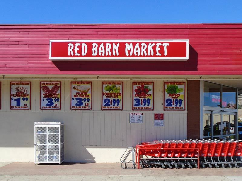 Customers can't miss this illuminated lightbox storefront sign for the Red Barn Market in Ventura, CA.
