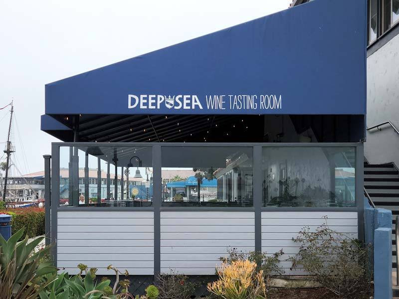 Awning signs offer clean looks and sophistication. For example, Deep Sea Wine Tasting Room in Ventura, CA 