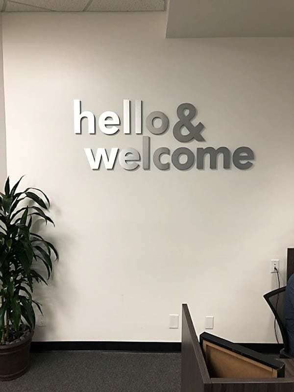 Interior signs like this metal laminate reception area sign for Smart Home Mortgage in Oxnard, CA has a local charm feel.