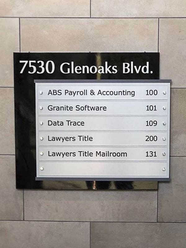 Corporate lobby signs like this one for 7530 Glenoaks Blvd. in Burbank, CA use acrylic name plates that can be easily updated.