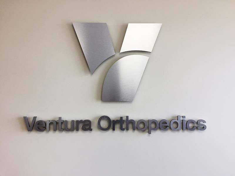Ventura Orthopedics logo sign uses metal laminates that look like brushed aluminum at a much lower cost.