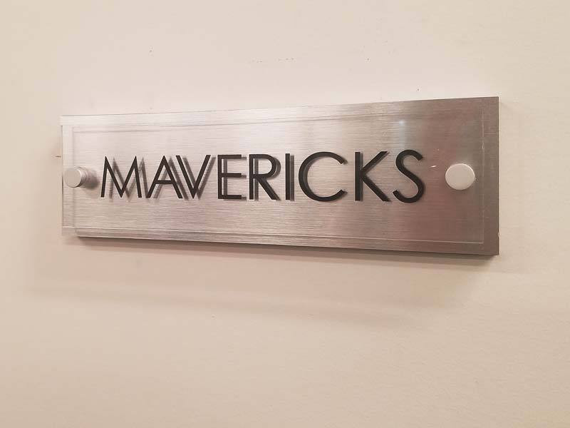 Brushed aluminum with a clear acrylic overlay with vinyl letters are always in style.