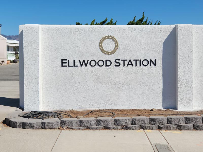 Dimensional letters sign mounted to the wall at the entrance of the property. Similar to a monument sign.