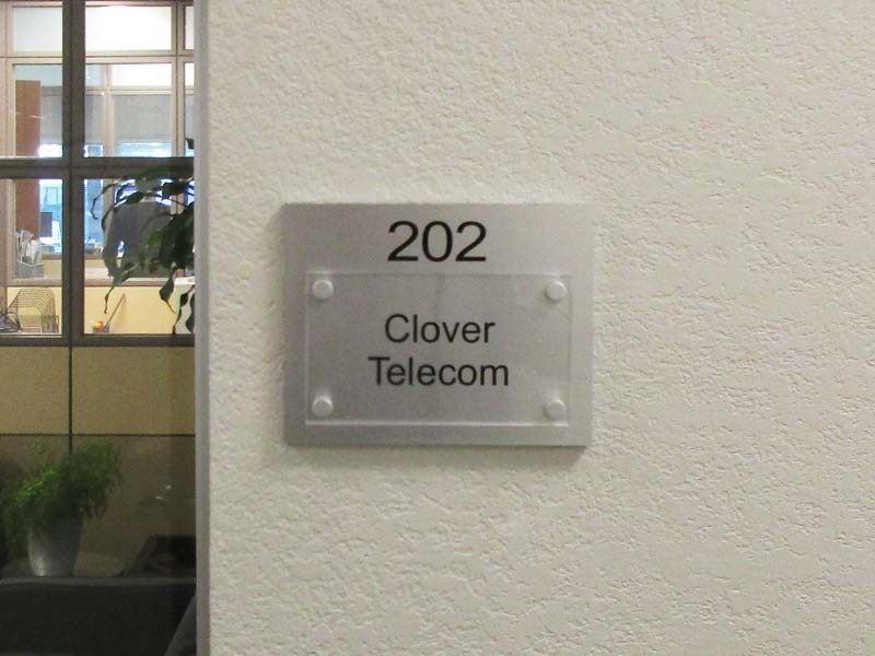 Plexiglass plaques are a popular choice like this one for Clover Telecom.