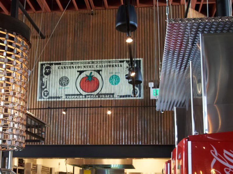 "Federal Department of Incredible Cheese" dollar bill sign overlooking the kitchen at Canyon Country, CA.