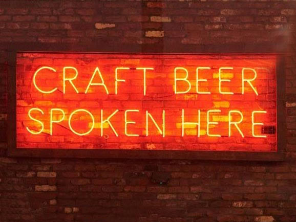 Custom signs like this neon sign create a sense of place in all Finney's Crafthouse locations.