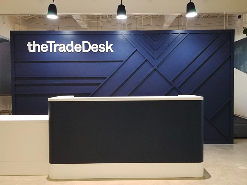 Office lobby signs add a sense of sophistication and create a strong visual impact the moment someone walks in—like this custom piece for The Trade Desk in LA.