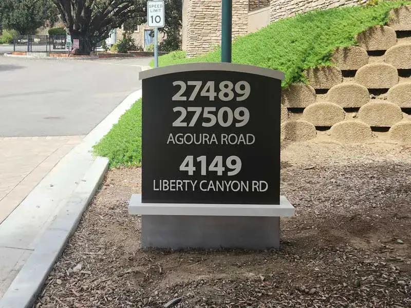 Monument sign marker, designed as part of a cohesive sign system for the property.