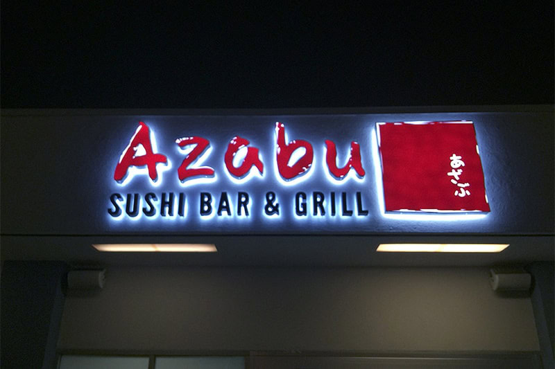 Halo-lit channel letter sign for Azabu Sushi Bar & Grill in Marina del Rey, illuminated at night.
