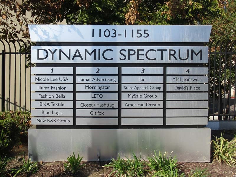 Dynamic Spectrum Business Park monument sign in Los Angeles, CA featuring a brushed aluminum face with modular tenant panels and integrated address identification.