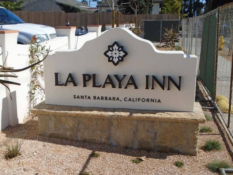 Architectural monument sign for La Playa Inn in Santa Barbara demonstrating how material selection and illumination impact monument sign cost.