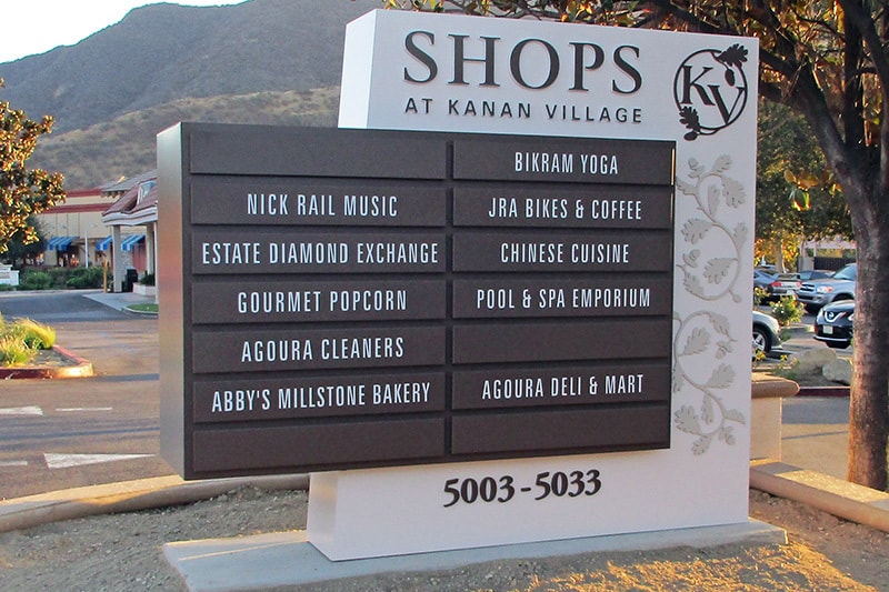 Shops at Kanan Village multi-tenant monument directory sign featuring modular tenant panels and integrated address identification.