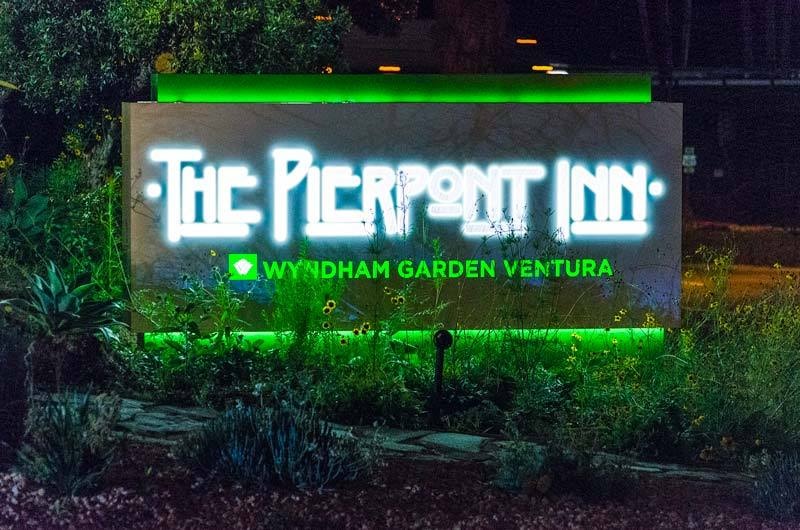 Illuminated monument sign for The Pierpont Inn in Ventura, CA featuring front-lit, side-lit, and halo-lit channel letters with energy-efficient LED illumination and integrated accent lighting.