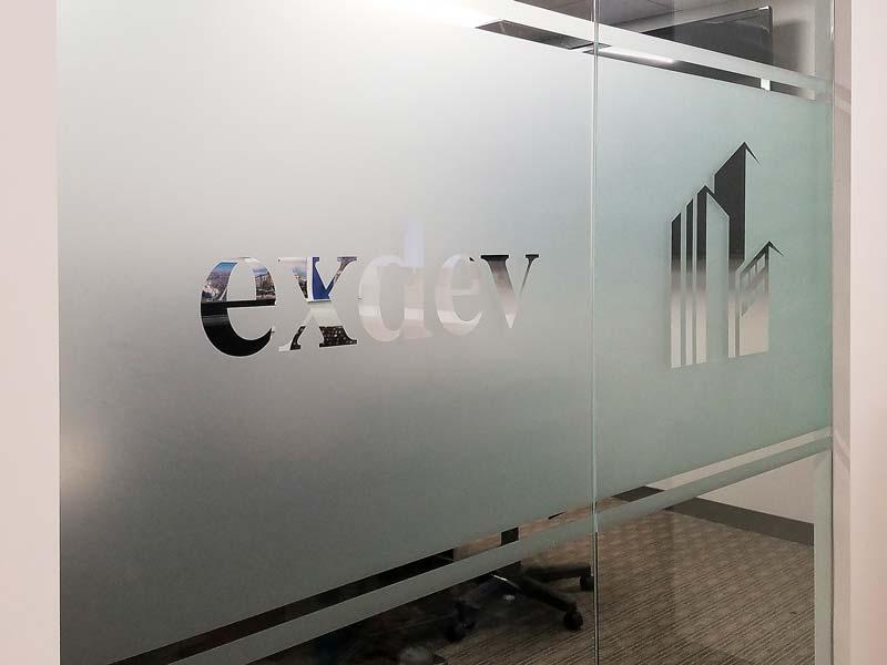 We design complete sign programs that include a variety of sign types, including frosted privacy window graphics for conference rooms—like this installation for ExDev in Cerritos, CA.