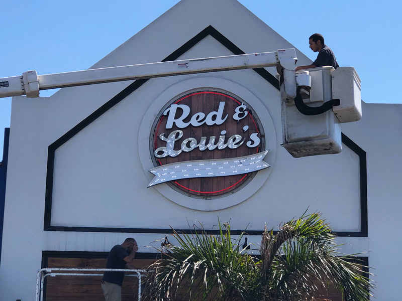 Illuminated LED restaurant sign installation in Hermosa Beach, California by Dave’s Signs