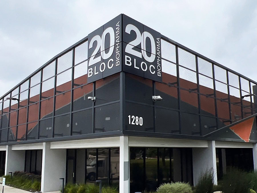 Corner-mounted building identification sign for 20 Bloc Biopharma in Thousand Oaks, CA.