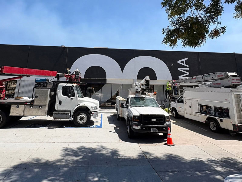 Architectural graphic installation in progress at 20 Bloc Biopharma.