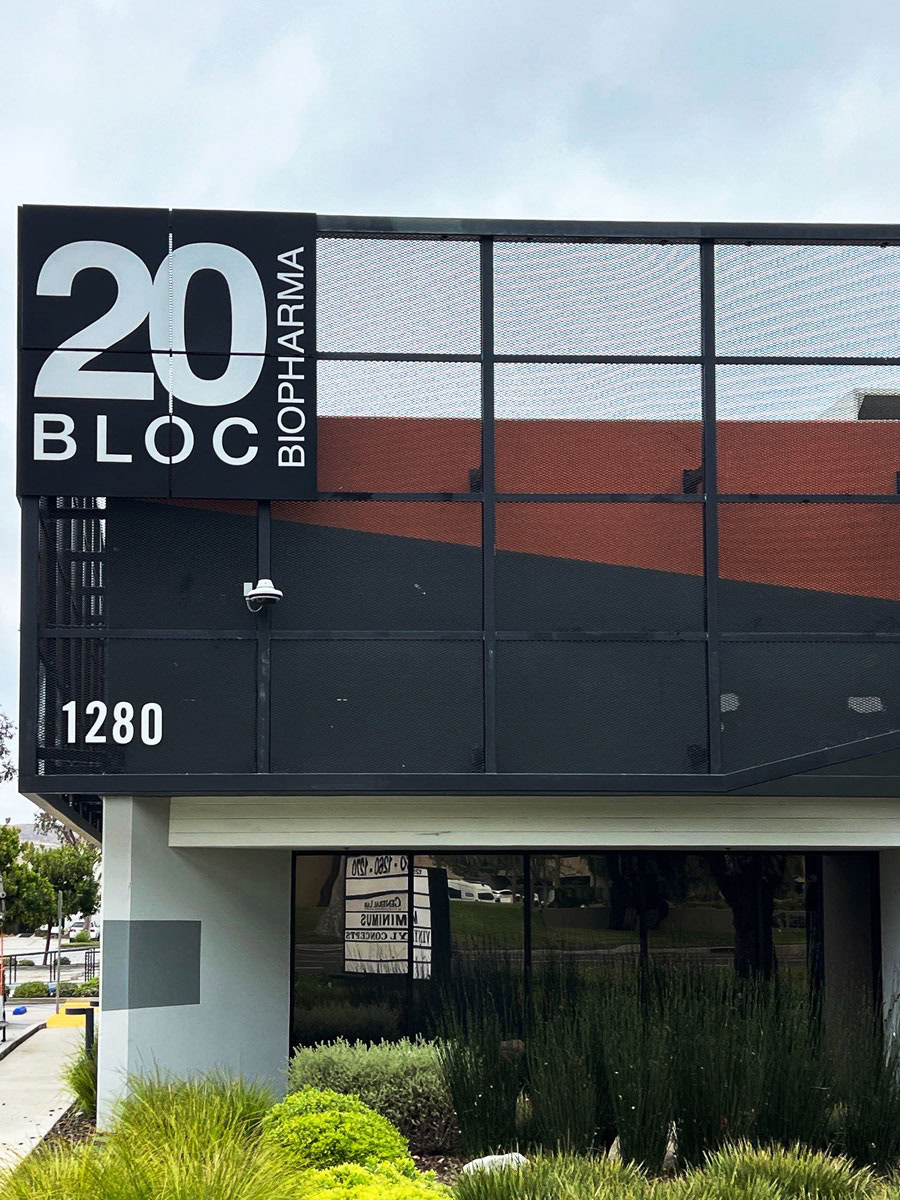Completed corner-mounted office building identification signs for 20 Bloc Biopharma in Thousand Oaks.